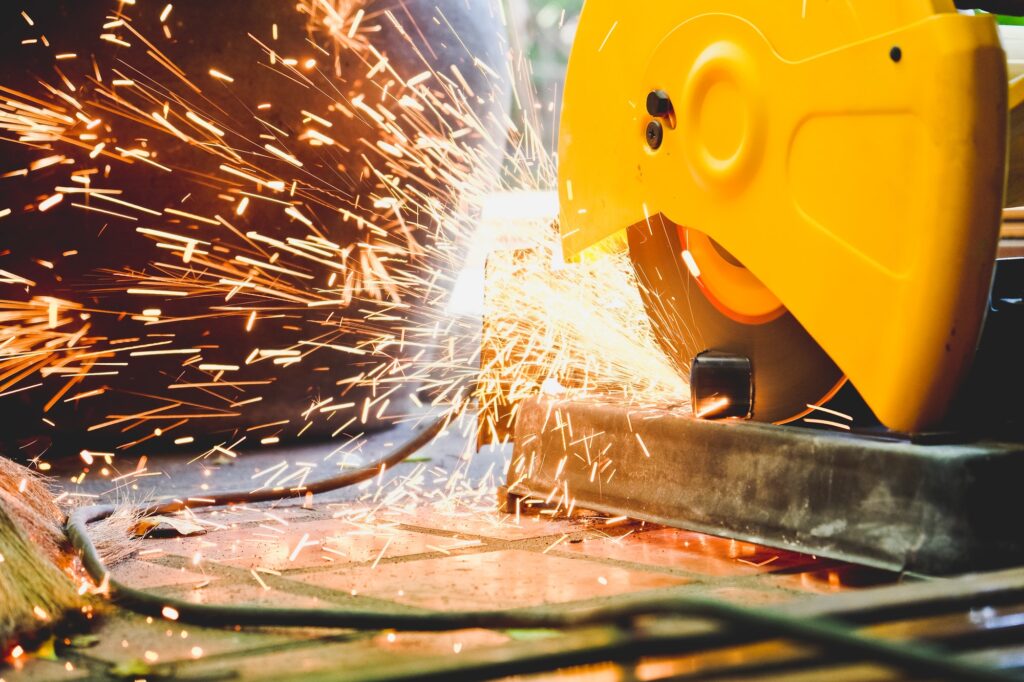 Metalworking / close up of cutting metal, Industrial Worker